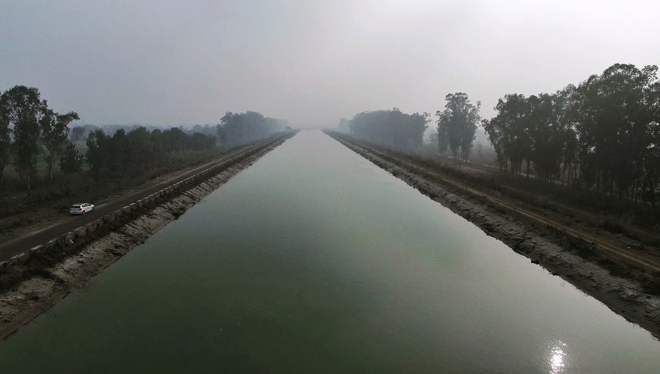 An aqueduct fades into the haze. â€” near Lucknow, Uttar Pradesh