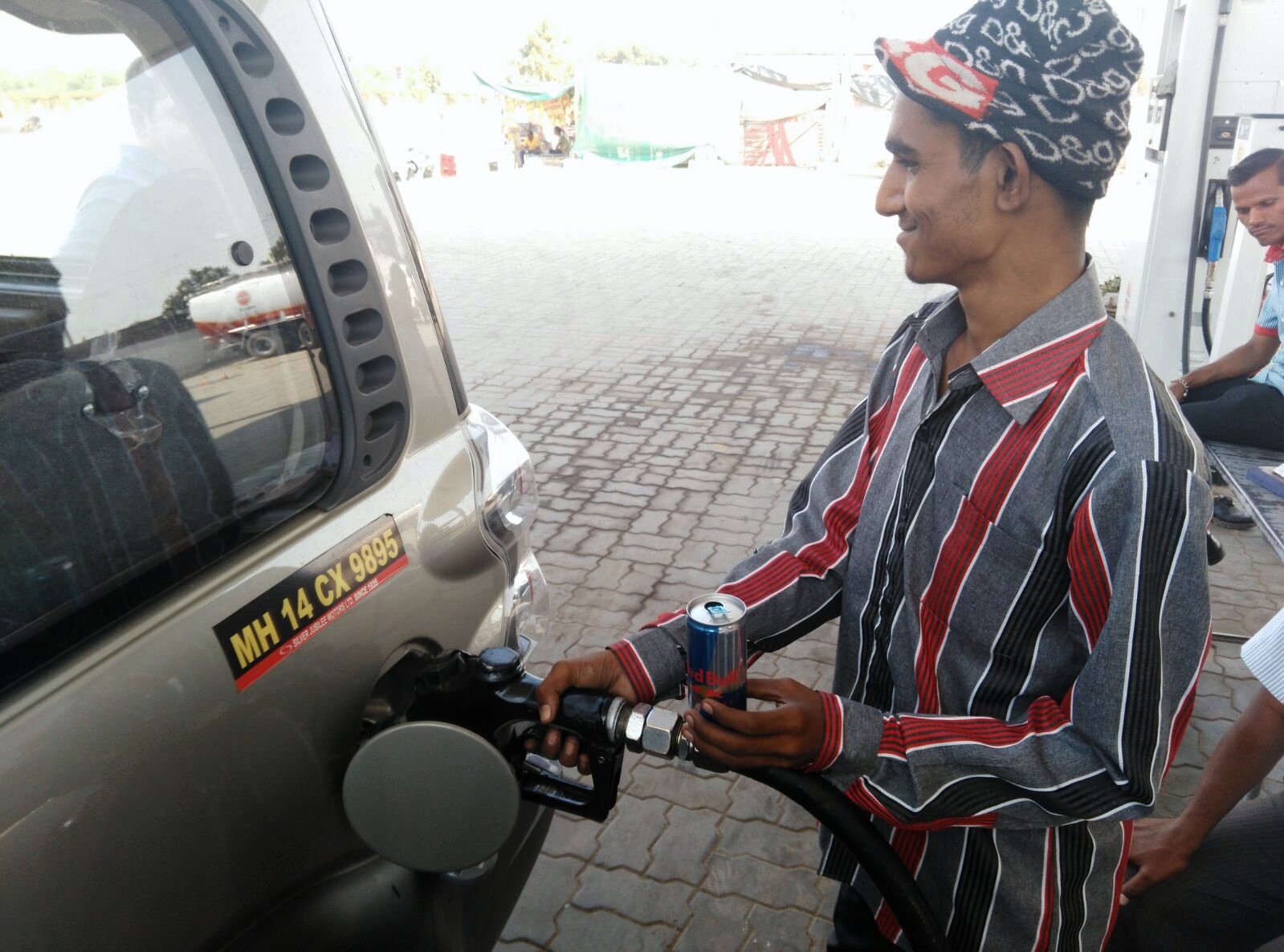 Filling up â€” and handing out the Red Bull that kept us going.