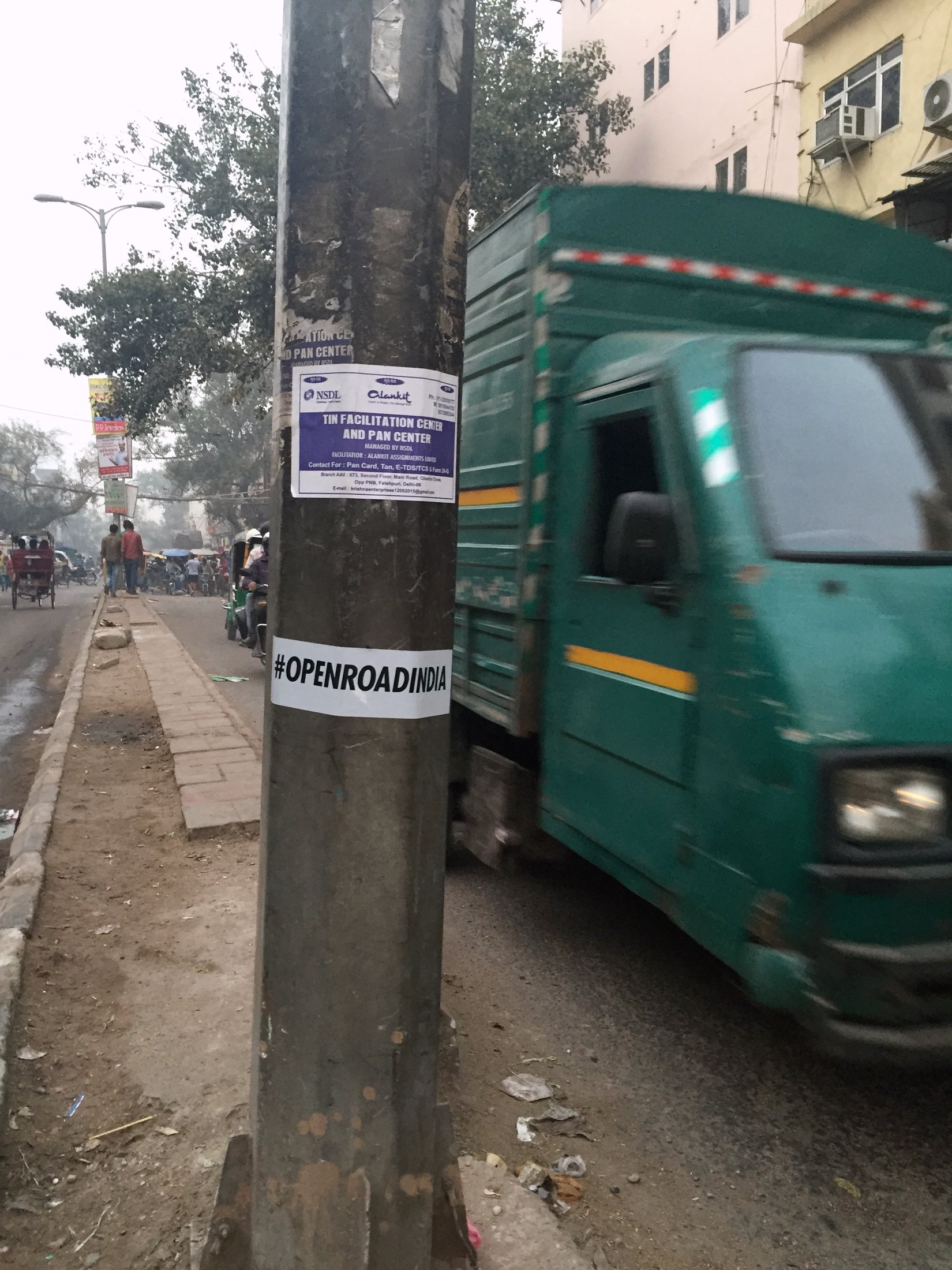 Our sticker on a pole in the city. â€” Delhi Â· Nov 2015